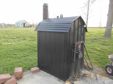 Outdoor wood burning boiler is designed to heat th