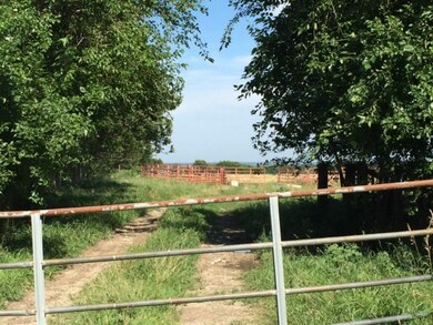 Gate to the property is at the north corner.
