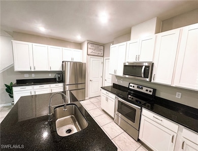 Kitchen featuring appliances with stainless steel