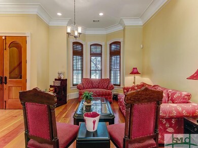Living room and entryway of parlor level in the ma