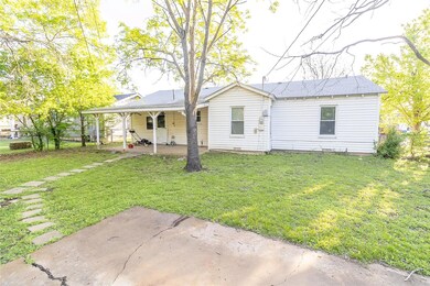 View of back of home with a patio area, fence, and