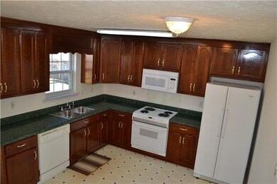 Counter space all the way around. Home is priced with appliances to stay (not pictured, washer and dryer)