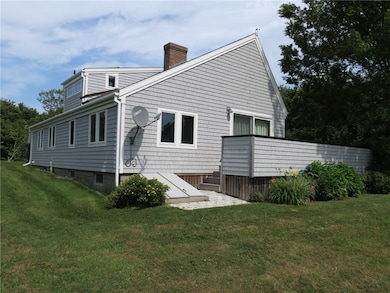 West exterior with bulkhead to basement