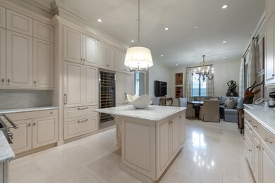 Chef's kitchen with eating table for 2 at the end 