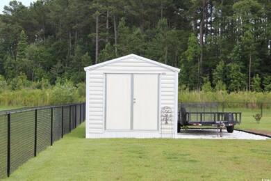 View of shed with a view of trees