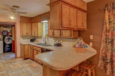 Kitchen with breakfast bar, laundry closet in the 