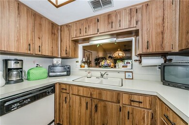 Kitchen has pass through with bar top.