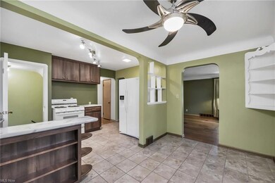 Dining room and view into kitchen.