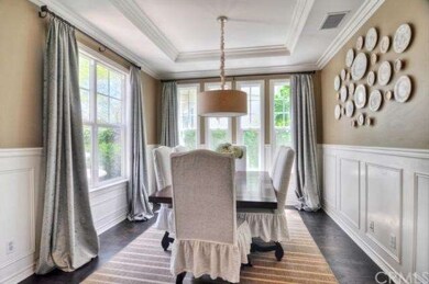 Elegant dining room with coffered ceiling and wain