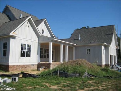 Exterior Back - Rear covered porch with large gara
