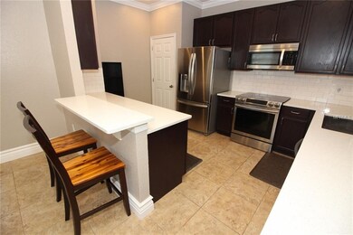 Updated Kitchen with tons of cabinets, quartz, and S/S