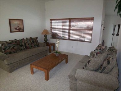 Living Room. Formal living room offers colossal pi