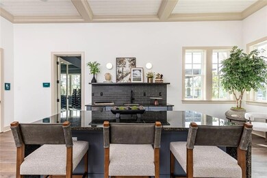 Bar with hardwood / wood-style floors, plenty of n