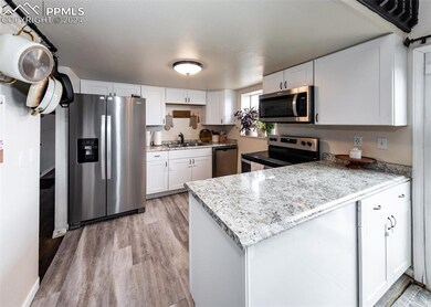 Kitchen featuring sink, appliances with stainless 