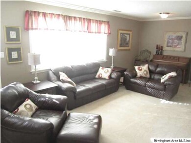 HUGE family room with large bank of cheery windows