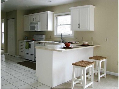 Kitchen. Open to the family w/ breakfast bar w/ ad