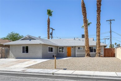 Ranch-style house featuring stucco siding and roof