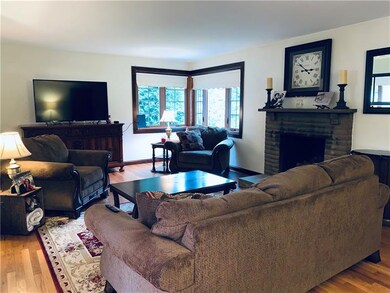 The spacious 22x13 living room has beautiful hardw