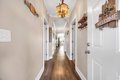 Corridor featuring arched walkways, ornamental mol