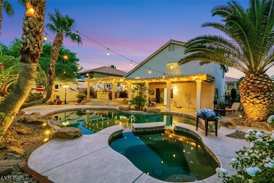 Pool at dusk featuring a patio area and a pool wit