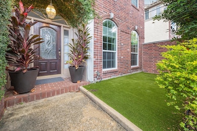 The turfed front patio is a great place to relax.