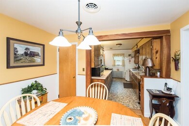 View of dining room, looking into the kitchen.  Th