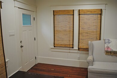Inviting entrance with natural light and cozy char
