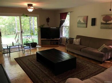 The spacious family room has wide sliding glass do