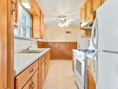You will relish this gas stove, refrigerator and view of your front yard from your sink.