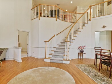 Graceful staircase from front entry.