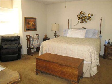 Master bedroom with a full attached bathroom and d
