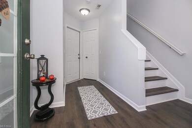 Entry w/new LVP flooring, large closet, and access to the oversized garage.