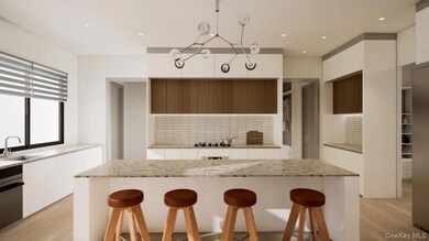 Kitchen with white cabinets, a sink, modern cabinets, decorative backsplash, and a breakfast bar