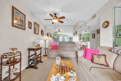 Living room featuring carpet floors and ceiling fa