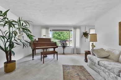 Living room featuring light colored carpet