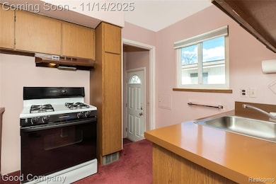 Kitchen with access through side door to driveway