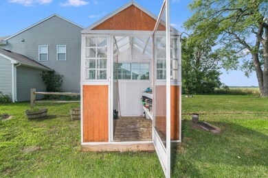 Sideyard with greenhouse