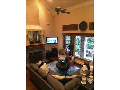 Living Room. Spacious family/living room and fireplace with extraordinary view of back private patios.