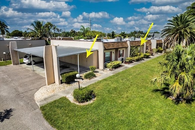 View of front facade featuring a front lawn and stucco siding