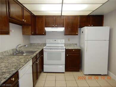 Kitchen features granite counters and all applianc