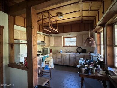 Kitchen with pendant lighting, light brown cabinet