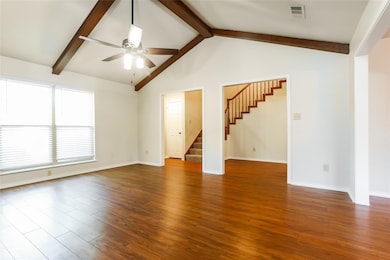 Unfurnished living room with vaulted ceiling with 