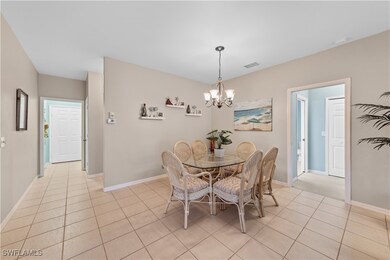 Dining room with light tile patterned floors, visi
