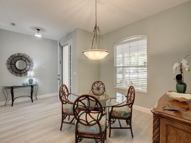 Dining area featuring light wood-style flooring and baseboards