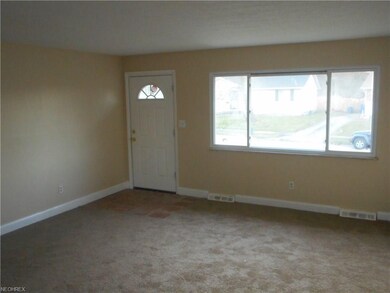 2017 front door. The freshly-painted living room o