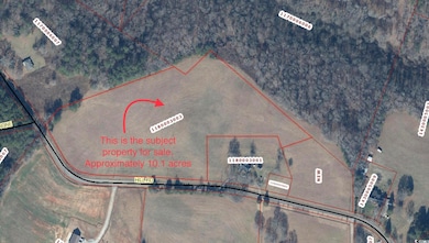 Aerial map of property and surrounding area with property parcel outlined