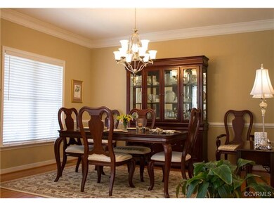 Dining Room, Hardwood Floors, Crown Molding, Chair