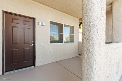 Entrance to property with stucco siding
