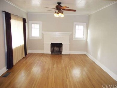 Living room with hardwood floors, fireplace and ce