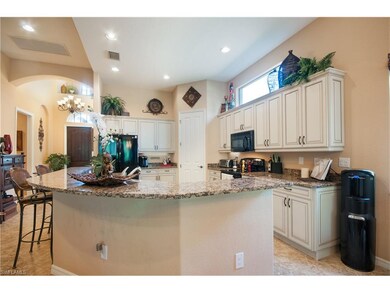 Updated kitchen with wrap-around bar height island